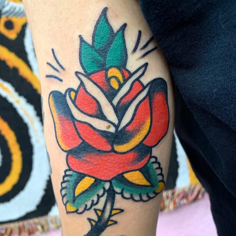 Traditional Tattoo Berlin - Tattoos by Mariano - Pete Corrie sits wearing sunglasses while Traditional tattoo artist Mariano tattoos him.