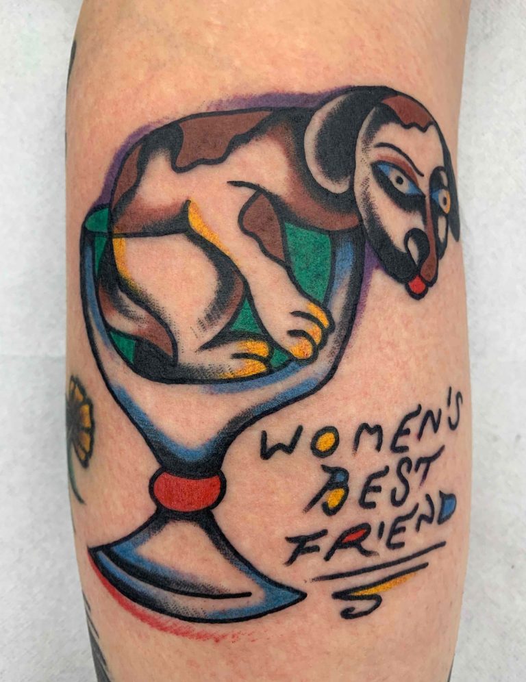 Traditional tattoo Berlin - Tattoos by Mariano - Tattoo of a dog in a drinking glass with the words “WOMEN'S BEST FRIEND.”