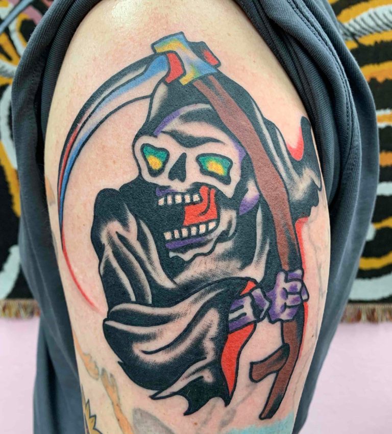 Traditional Tattoo Berlin - Tattoos by Mariano - Tattoo of a skeleton with a scythe, colorful eyes, and a black robe.
