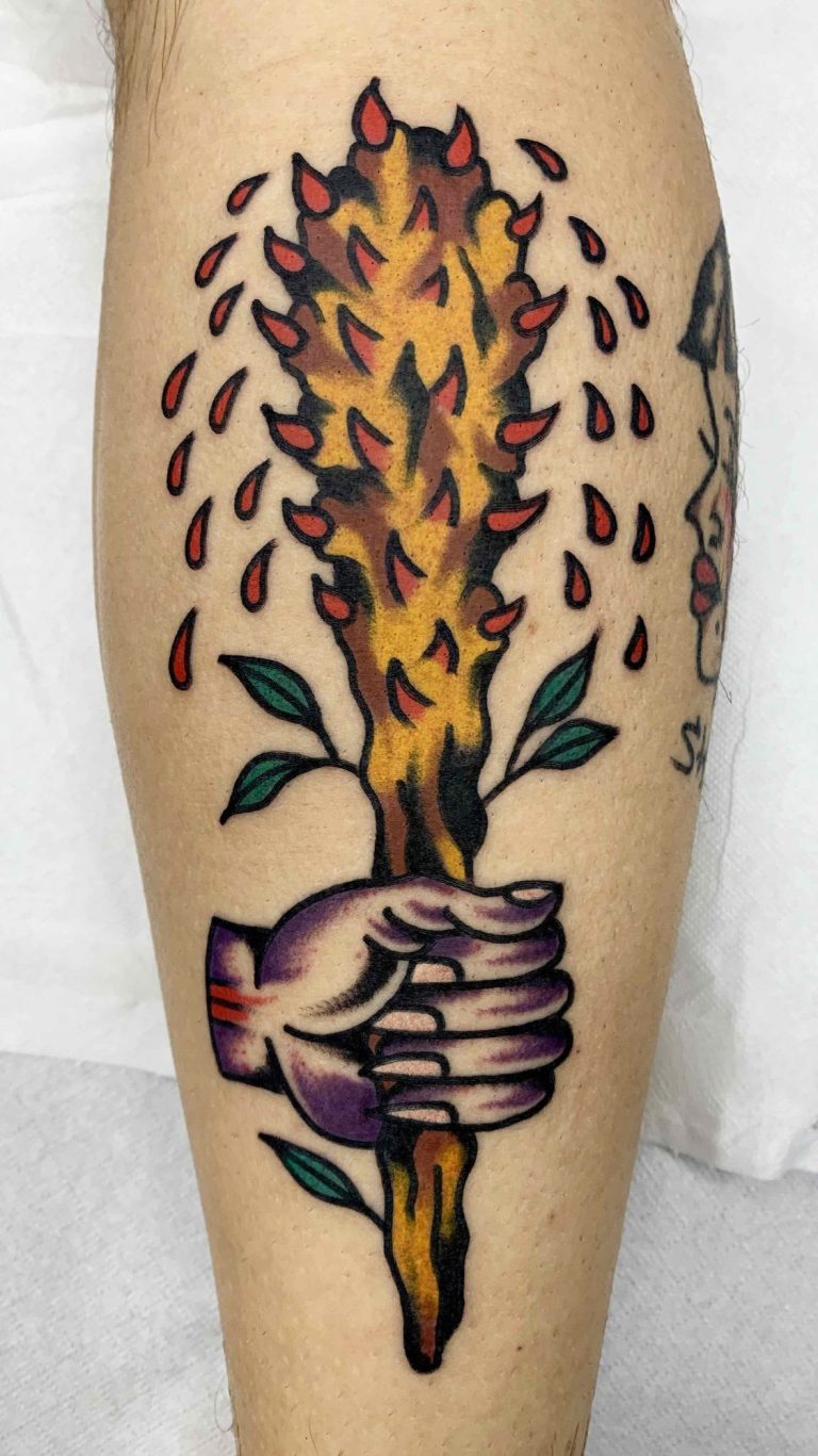Traditional tattoo Berlin - Tattoos by Mariano - A tattooed hand holds a burning stick with green leaves.